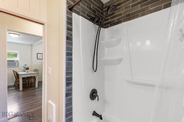 718 W Front, Livingston, MT 59047 - bathroom featuring shower / tub combo, wood finished floors, and cooling unit