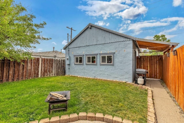 718 W Front, Livingston, MT 59047 - rear view of house with stucco siding and a fenced backyard