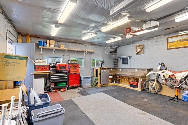 718 W Front, Livingston, MT 59047 - garage with a workshop area, a garage door opener, concrete block wall, and a ceiling fan