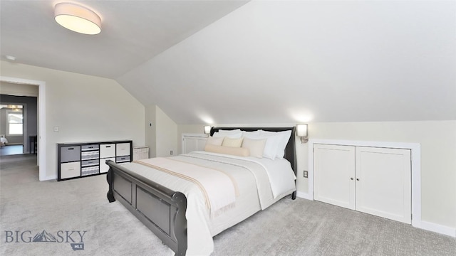 1008 E Missoula, Belgrade, MT 59714 - bedroom featuring light colored carpet and lofted ceiling