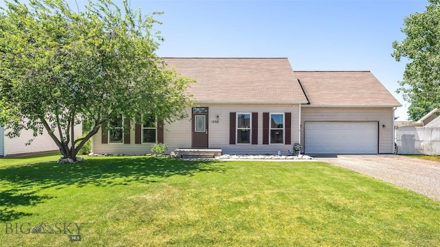 1008 E Missoula, Belgrade, MT 59714 - cape cod-style house with driveway, an attached garage, and a front yard