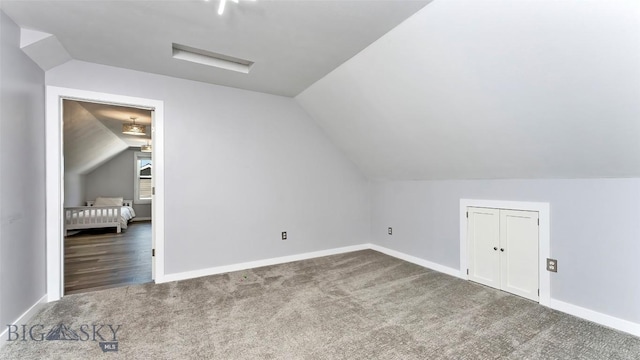1008 E Missoula, Belgrade, MT 59714 - additional living space featuring carpet flooring and lofted ceiling