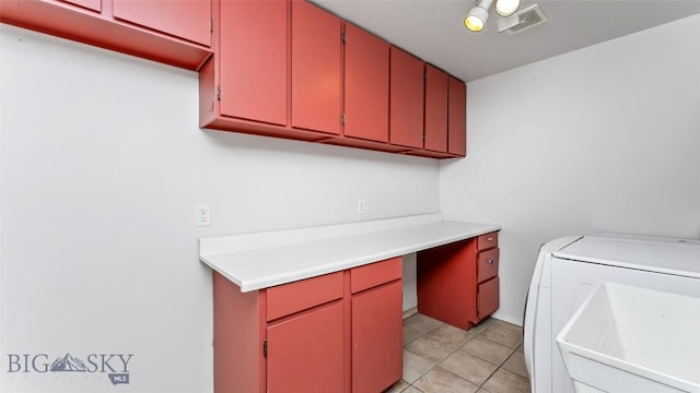 1008 E Missoula, Belgrade, MT 59714 - laundry room with washing machine and clothes dryer, light tile patterned floors, and cabinet space