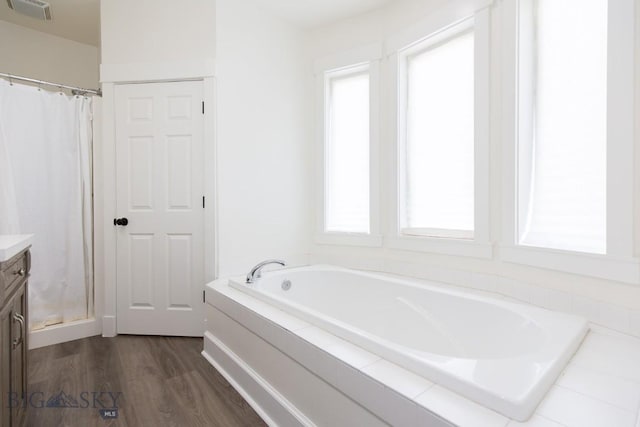 894 Rogers, Bozeman, MT 59718 - bathroom with vanity, a bath, and wood finished floors