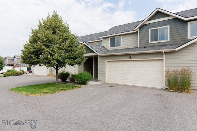 86 Tail Feather Unit C, Bozeman, MT 59718 - townhome / multi-family property featuring driveway, an attached garage, and a shingled roof