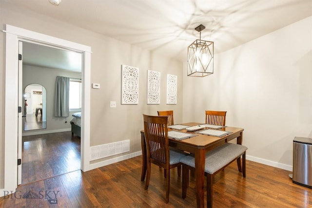 86 Tail Feather Unit C, Bozeman, MT 59718 - dining space featuring dark wood-style flooring and arched walkways