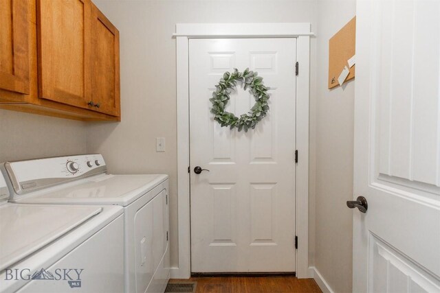 86 Tail Feather Unit C, Bozeman, MT 59718 - laundry area with independent washer and dryer, cabinet space, and dark wood-type flooring