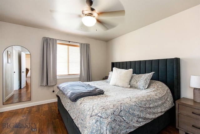 86 Tail Feather Unit C, Bozeman, MT 59718 - bedroom featuring dark wood finished floors, ceiling fan, and arched walkways
