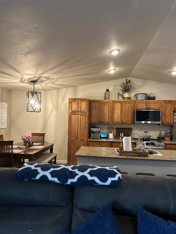 86 Tail Feather Unit C, Bozeman, MT 59718 - living room featuring vaulted ceiling