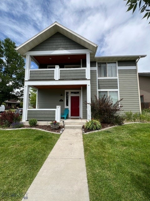 3885 Equestrian Ln, Bozeman, MT 59718 - view of front of property featuring a balcony and a front lawn