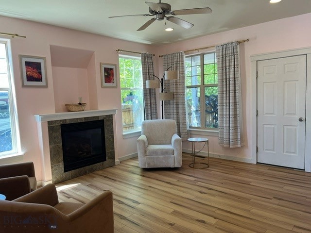 3885 Equestrian Ln, Bozeman, MT 59718 - living area with wood finished floors, a ceiling fan, recessed lighting, and a tile fireplace