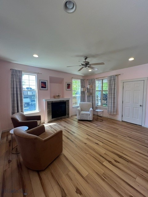 3885 Equestrian Ln, Bozeman, MT 59718 - living room featuring a fireplace, light wood finished floors, ceiling fan, and recessed lighting