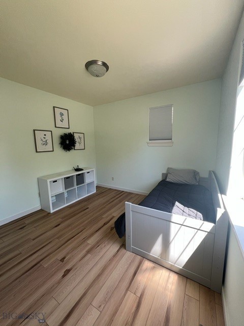 3885 Equestrian Ln, Bozeman, MT 59718 - unfurnished bedroom with wood finished floors