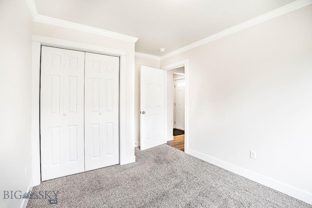 708 Pierre St, Belgrade, MT 59714 - unfurnished bedroom featuring carpet, crown molding, and a closet