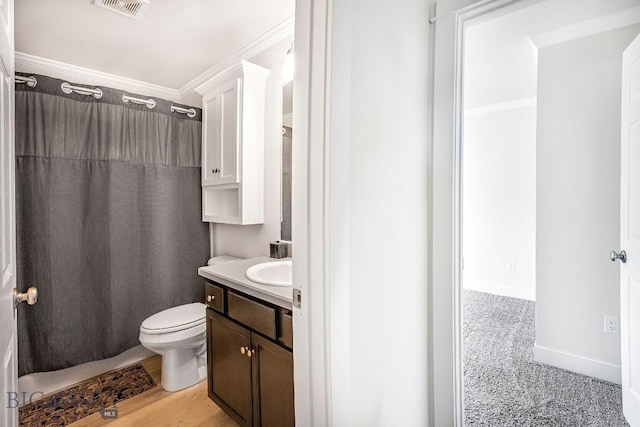 708 Pierre St, Belgrade, MT 59714 - bathroom with vanity, ornamental molding, and shower / tub combo with curtain