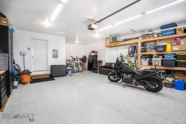 708 Pierre St, Belgrade, MT 59714 - garage with electric panel and a garage door opener