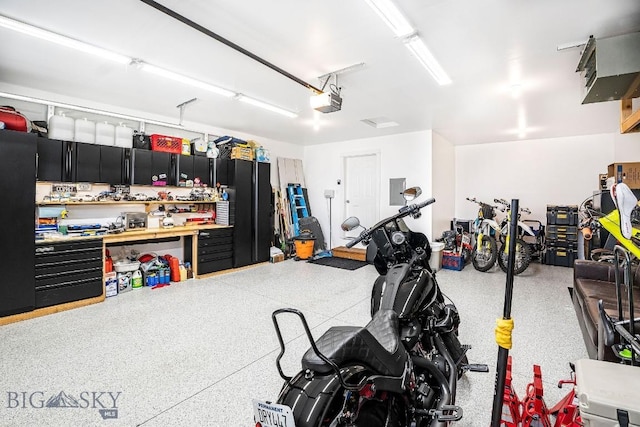 708 Pierre St, Belgrade, MT 59714 - garage featuring a garage door opener and electric panel