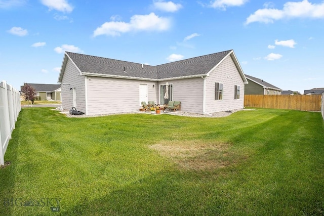 708 Pierre St, Belgrade, MT 59714 - back of house with a fenced backyard and a patio area