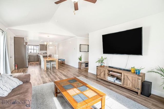 708 Pierre St, Belgrade, MT 59714 - living area with light wood-style floors, lofted ceiling, a ceiling fan, and ornamental molding