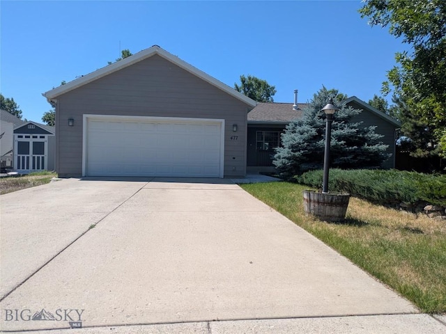 477 W River Rock, Belgrade, MT 59714 - ranch-style house featuring concrete driveway and an attached garage