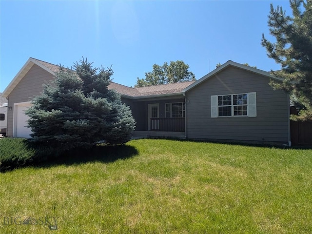 477 W River Rock, Belgrade, MT 59714 - view of front facade featuring a front lawn and a garage
