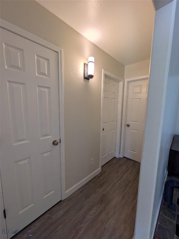477 W River Rock, Belgrade, MT 59714 - corridor featuring dark wood-style floors and baseboards