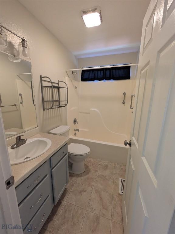 477 W River Rock, Belgrade, MT 59714 - bathroom with vanity, washtub / shower combination, and tile patterned flooring