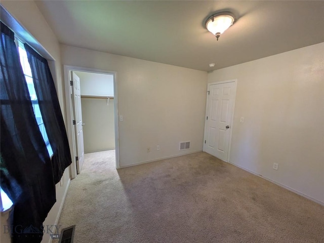 477 W River Rock, Belgrade, MT 59714 - unfurnished room with light carpet and baseboards