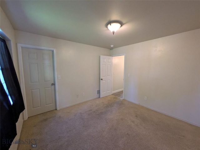 477 W River Rock, Belgrade, MT 59714 - spare room featuring carpet and baseboards