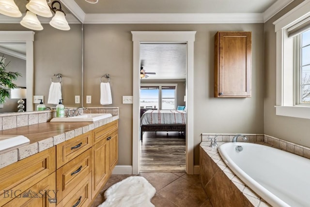 3609 Fieldstone W, Bozeman, MT 59715 - ensuite bathroom with vanity, healthy amount of natural light, a bath, ornamental molding, and tile patterned floors