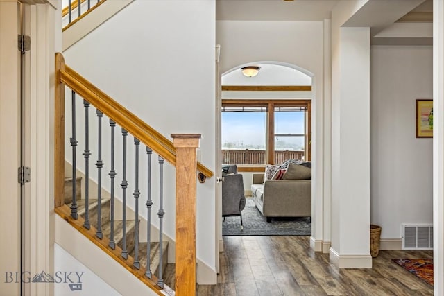 3609 Fieldstone W, Bozeman, MT 59715 - foyer entrance featuring wood finished floors, arched walkways, and stairway