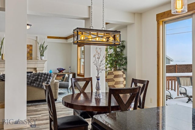 3609 Fieldstone W, Bozeman, MT 59715 - dining area with a fireplace and wood finished floors