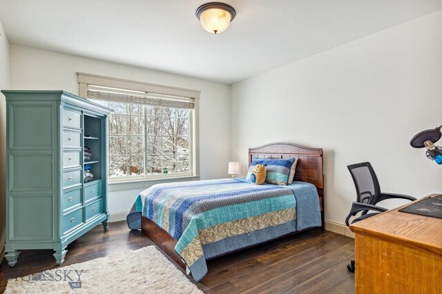 3609 Fieldstone W, Bozeman, MT 59715 - bedroom featuring dark wood-style flooring and a desk