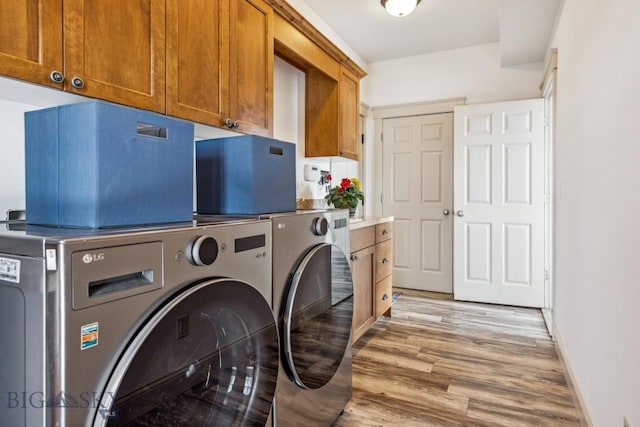 3609 Fieldstone W, Bozeman, MT 59715 - laundry room featuring washer and dryer, cabinet space, and light wood finished floors