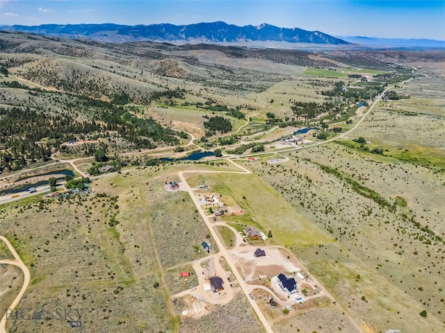 209 W Madison St, Virginia City, MT 59755 - aerial view of property and surrounding area with a mountainous background and rural landscape