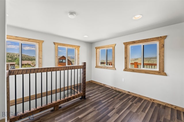 209 W Madison St, Virginia City, MT 59755 - empty room featuring recessed lighting, dark wood-style floors, and a smoke detector