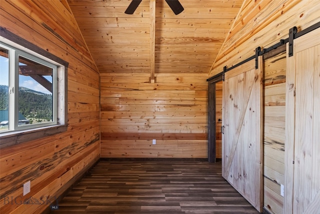 209 W Madison St, Virginia City, MT 59755 - spare room with vaulted ceiling, a barn door, wooden walls, wood ceiling, and dark wood-type flooring