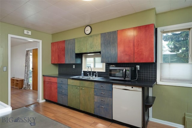 815 N Grand, Bozeman, MT 59715 - kitchen featuring white dishwasher, stainless steel microwave, dark countertops, and light wood finished floors