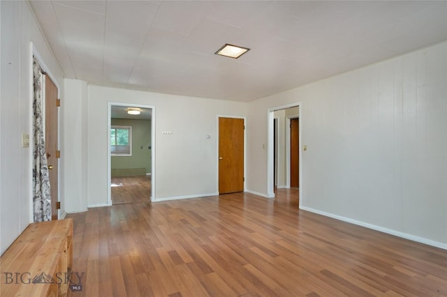 815 N Grand, Bozeman, MT 59715 - unfurnished room with wood finished floors and baseboards