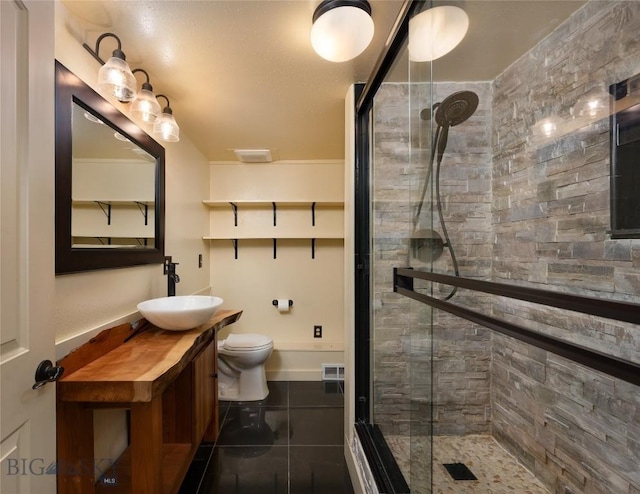 815 N Grand, Bozeman, MT 59715 - full bathroom featuring a shower stall, vanity, and tile patterned flooring