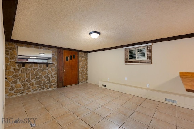815 N Grand, Bozeman, MT 59715 - unfurnished living room featuring a textured ceiling, crown molding, and light tile patterned flooring