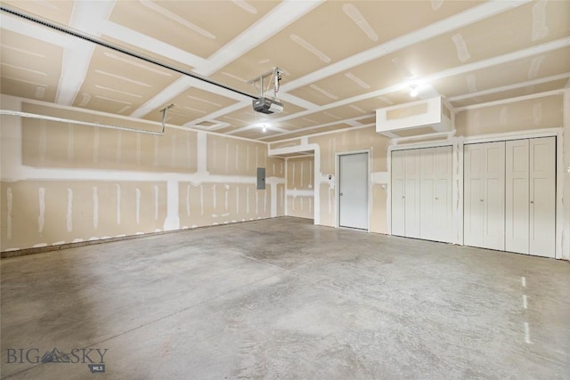 152 Goldcrest Ln, Bozeman, MT 59715 - garage featuring a garage door opener and electric panel