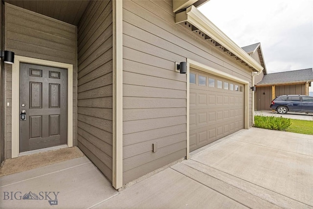 152 Goldcrest Ln, Bozeman, MT 59715 - garage featuring concrete driveway