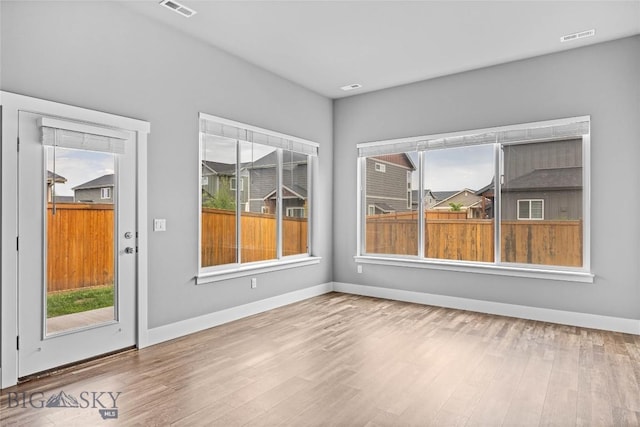 152 Goldcrest Ln, Bozeman, MT 59715 - empty room featuring healthy amount of natural light and wood finished floors