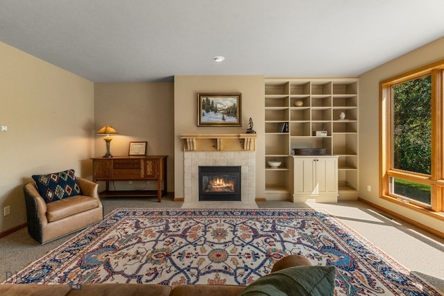 3300 E Graf Unit 26, Bozeman, MT 59715 - carpeted living room with a tile fireplace and built in shelves