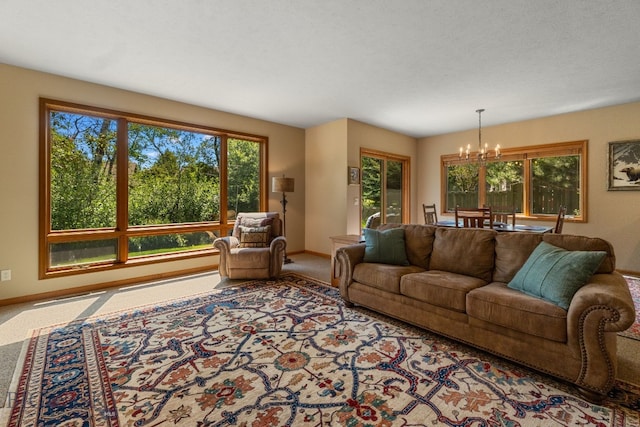 3300 E Graf Unit 26, Bozeman, MT 59715 - carpeted living room featuring a chandelier and baseboards