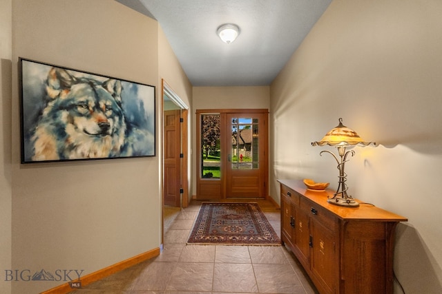 3300 E Graf Unit 26, Bozeman, MT 59715 - entryway with baseboards and light tile patterned floors