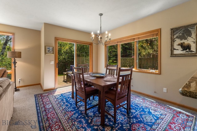 3300 E Graf Unit 26, Bozeman, MT 59715 - dining room featuring a chandelier and carpet floors