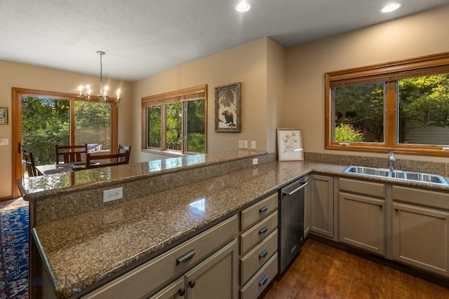 3300 E Graf Unit 26, Bozeman, MT 59715 - kitchen with stainless steel dishwasher, a peninsula, a chandelier, recessed lighting, and dark wood-style floors