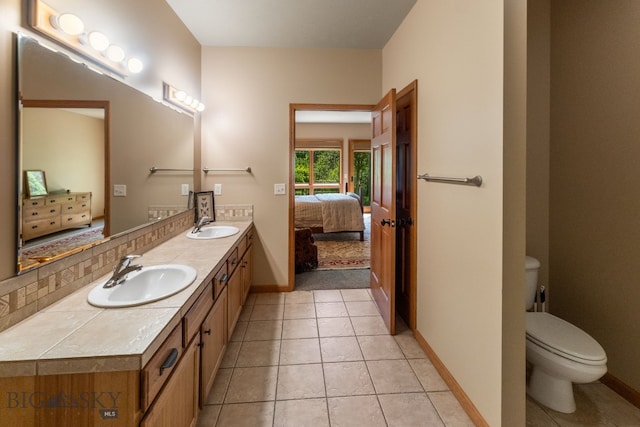 3300 E Graf Unit 26, Bozeman, MT 59715 - bathroom with connected bathroom, double vanity, and tile patterned floors